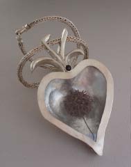 Contact us for handmade silver jewelry and gold jewelry with precious stones, as well as ring sizing and jewelry repairs. Located in Oregon, Ohio.